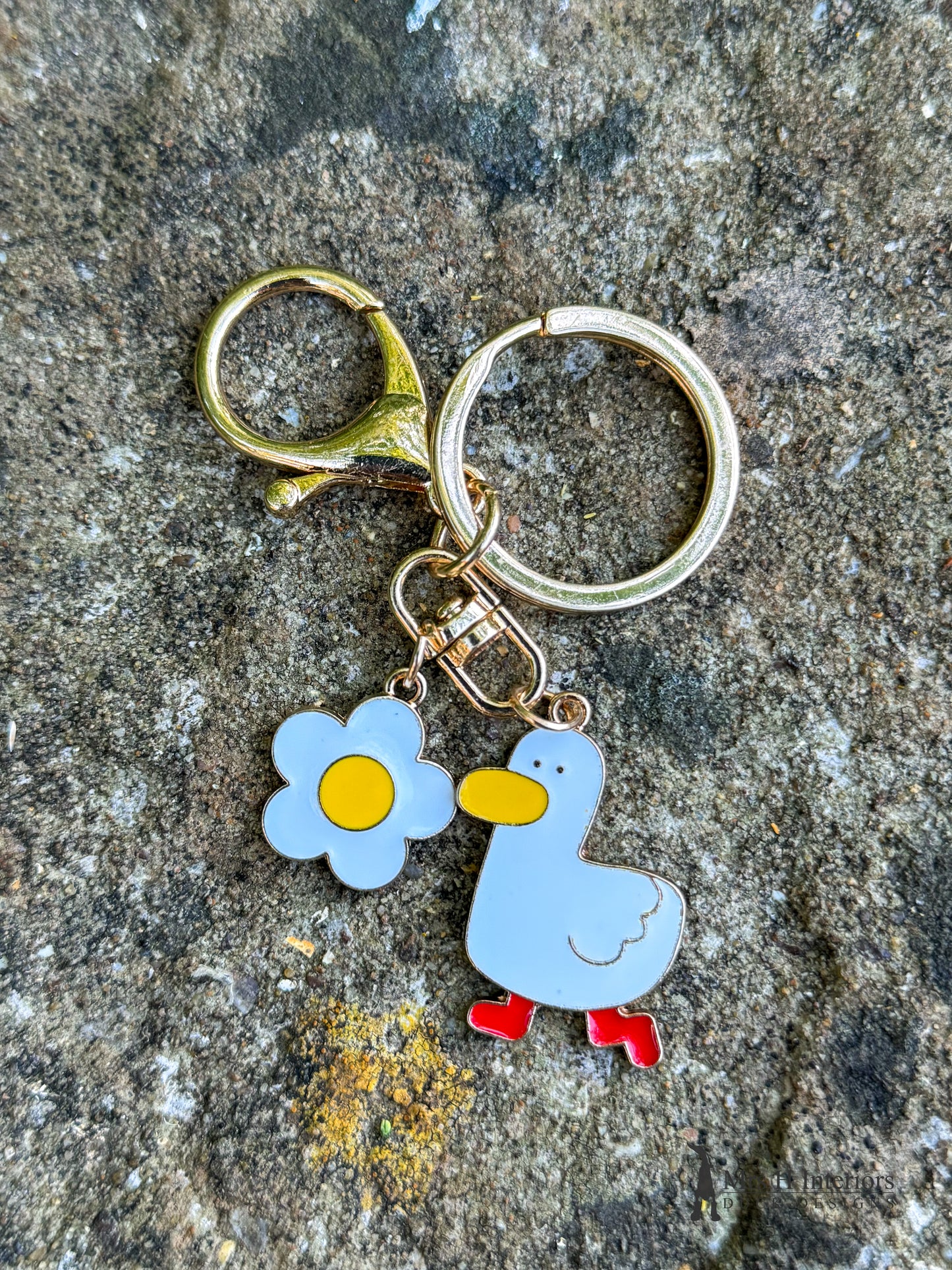 Blossom duck metal key ring.