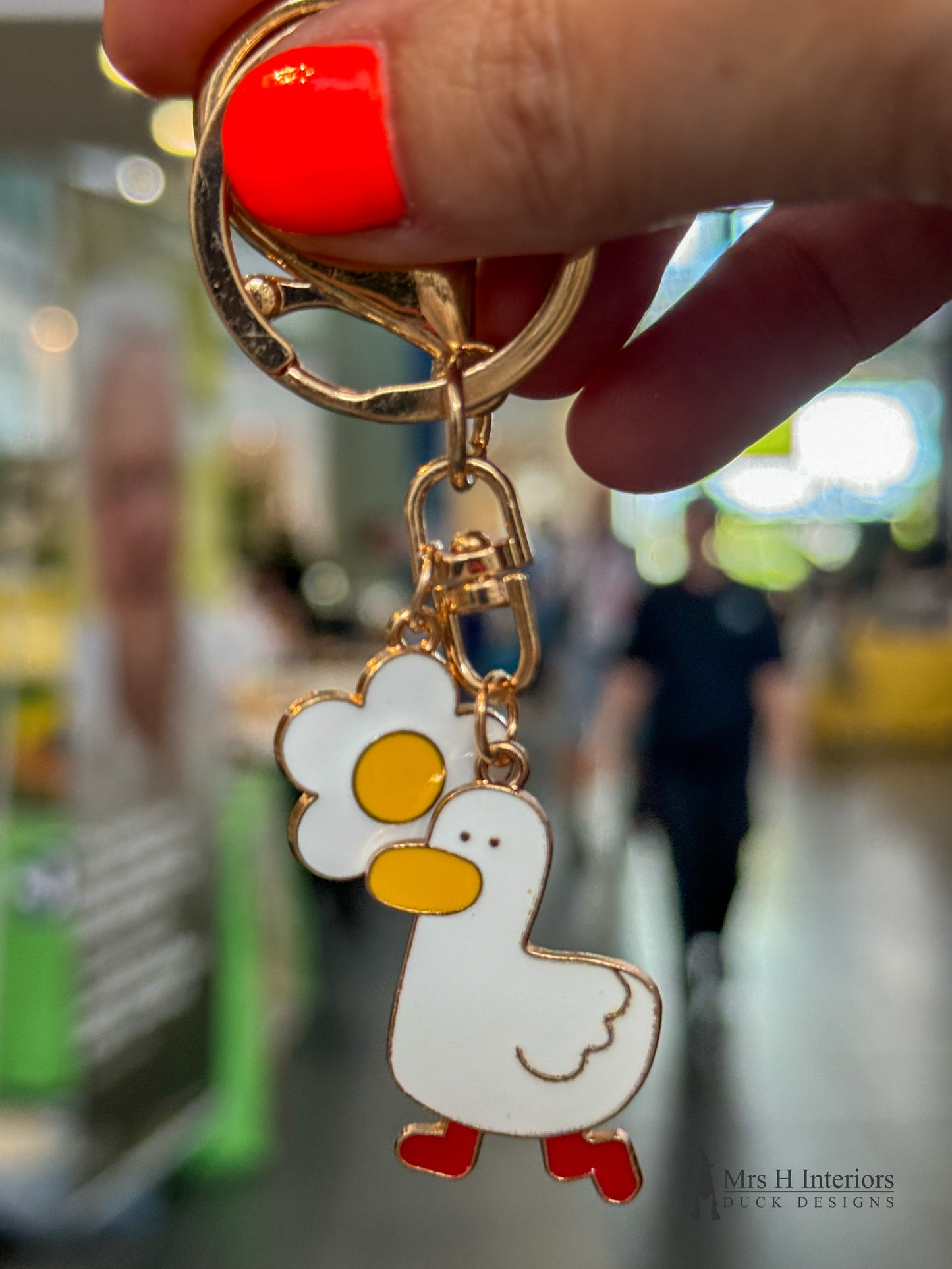 Blossom duck metal key ring.